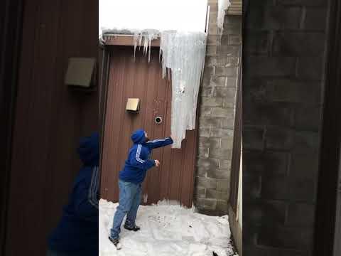 Knocking down massive icicle